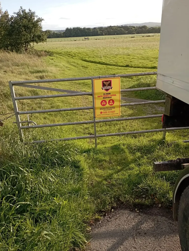Guard Force Security key holding sign at a rural property gate in North Cork